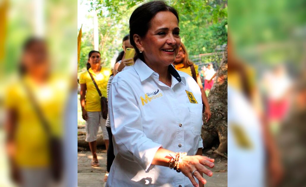 Escoltas de candidata portan armas de uso exclusivo