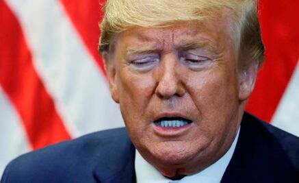 Wall Street cae por el comercio y posible juicio a Trump